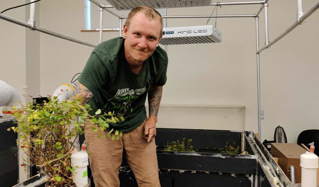 UNH graduate student Sean Schaefer working with permafrost-associated microbial populations