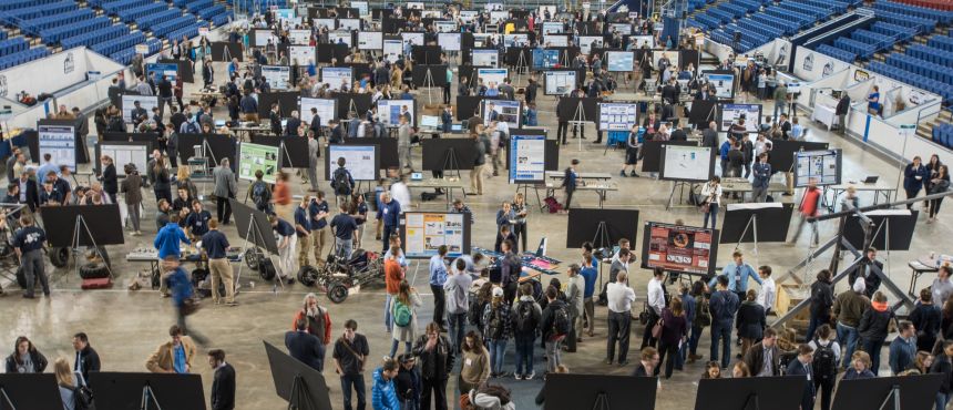 URC floor shot. Hundreds of students and visitors examine dozens of research posters in the Whittemore Center Arena